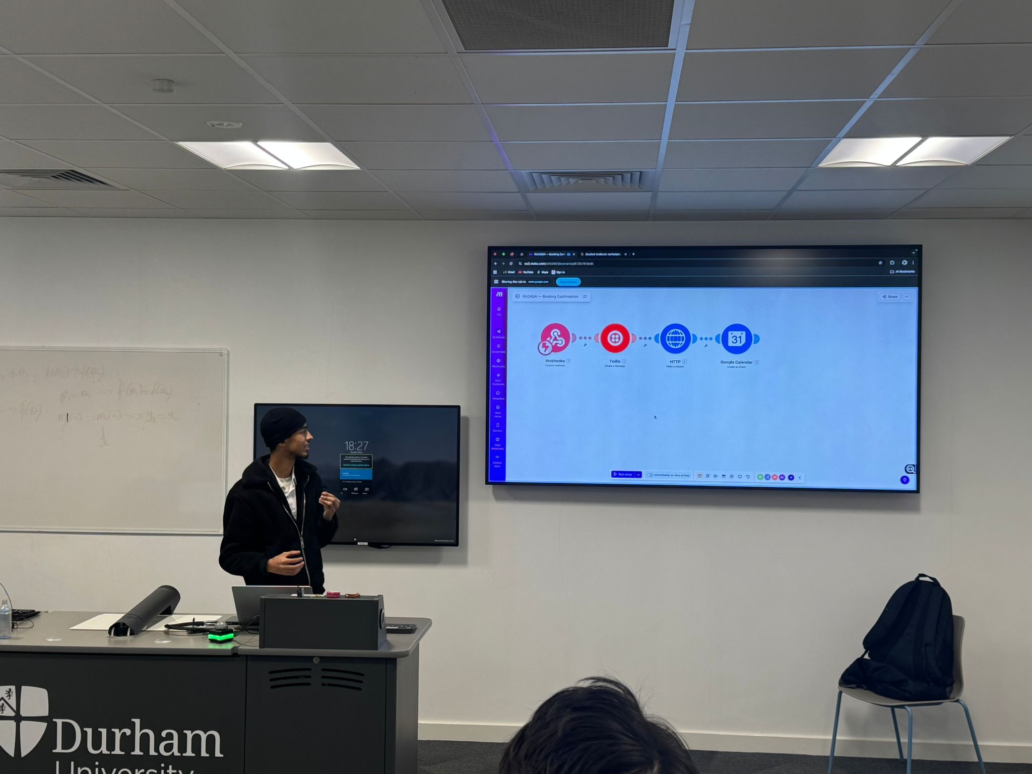 Presenter demonstrating an automation workflow during the AI literacy workshop.